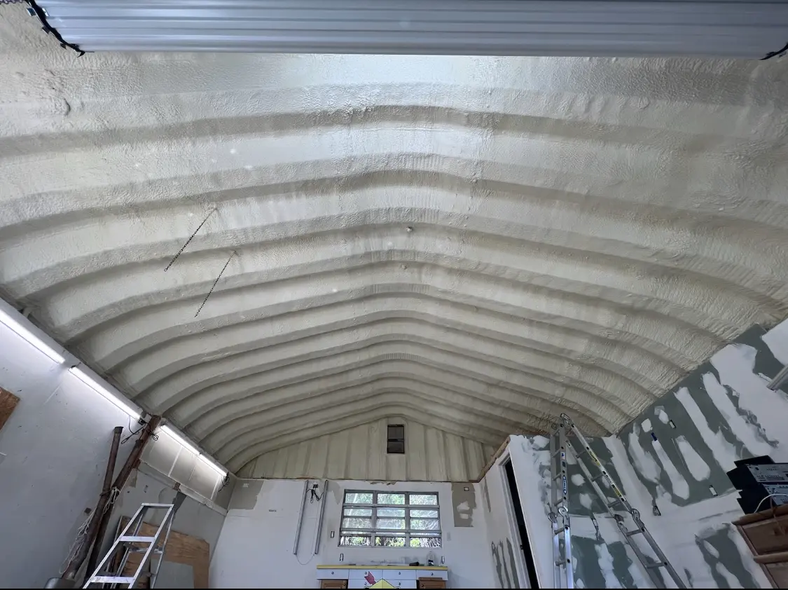 Spray polyurethane foam applied to the underside of a metal roof deck in Thompson